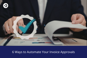 Hands reviewing invoice documents on a desk with a digital check‑mark approval graphic overlaid, symbolizing automated invoice approval processes.